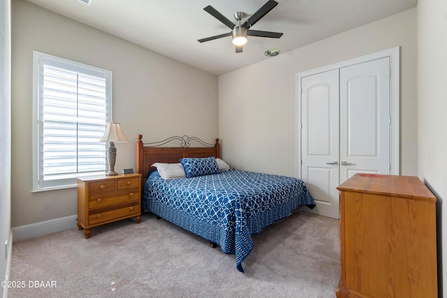 650 Woodbridge Dr, Ormond Beach, FL 32174 - bedroom featuring a closet, carpet floors, ceiling fan, and baseboards