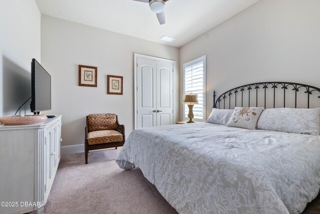 650 Woodbridge Dr, Ormond Beach, FL 32174 - bedroom with carpet, a closet, baseboards, and ceiling fan