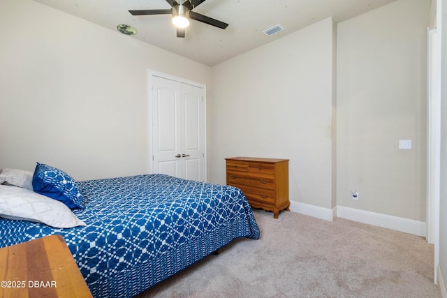 650 Woodbridge Dr, Ormond Beach, FL 32174 - bedroom with carpet flooring, a closet, baseboards, and ceiling fan