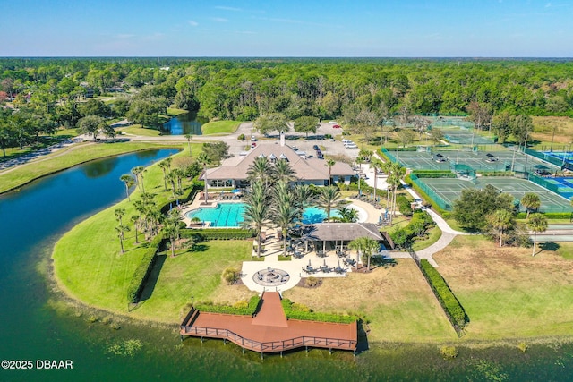 650 Woodbridge Dr, Ormond Beach, FL 32174 - drone / aerial view of a pool area, a nearby body of water, and a heavily wooded area