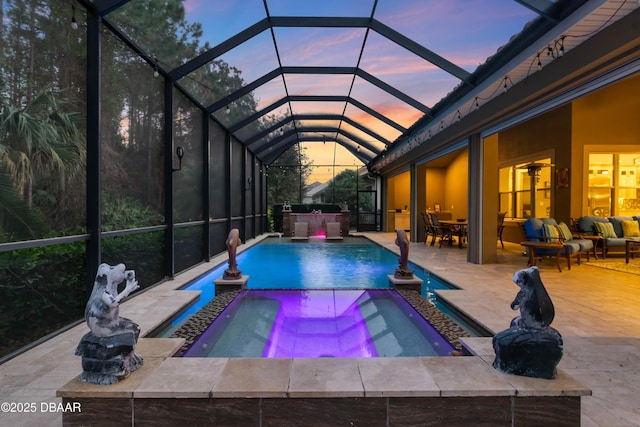 650 Woodbridge Dr, Ormond Beach, FL 32174 - view of swimming pool featuring a patio, a pool with connected hot tub, an outdoor living space, a lanai, and outdoor dining space