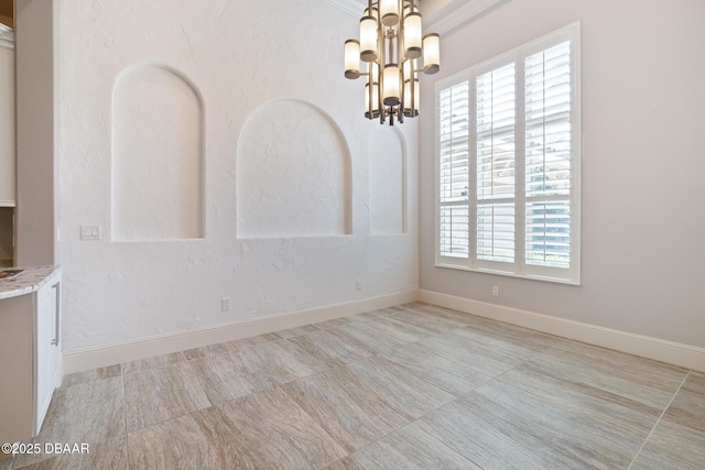 650 Woodbridge Dr, Ormond Beach, FL 32174 - unfurnished dining area featuring a chandelier and baseboards