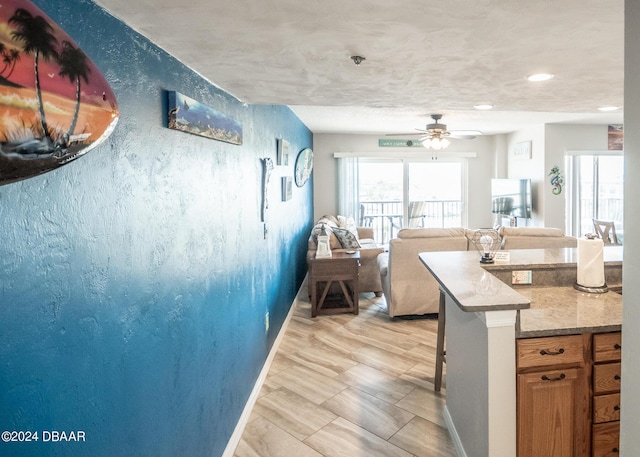 2615 S Atlantic Ave Unit 5C, Daytona Beach Shores, FL 32118 - kitchen with recessed lighting, a ceiling fan, open floor plan, and a breakfast bar
