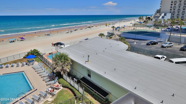 bird's eye view with a water view and a beach view