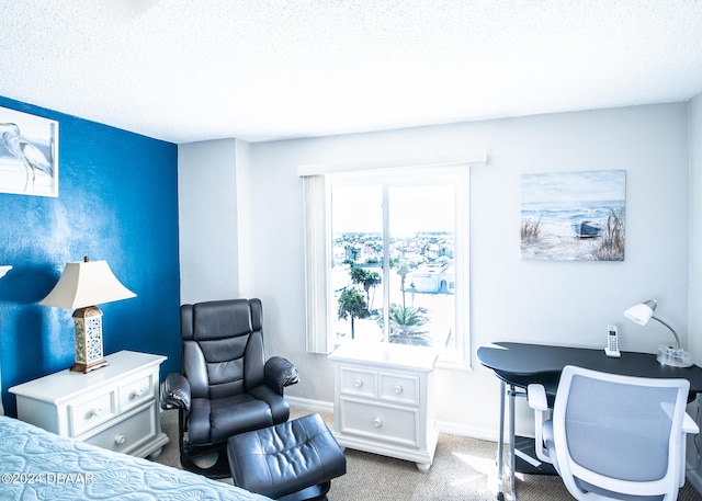 carpeted bedroom featuring a textured ceiling