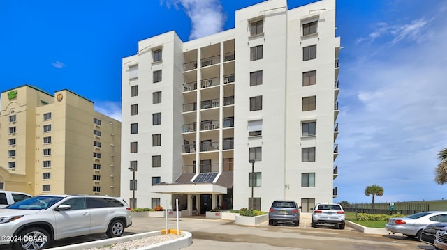 2615 S Atlantic Ave Unit 5C, Daytona Beach Shores, FL 32118 - view of apartment building / complex featuring uncovered parking
