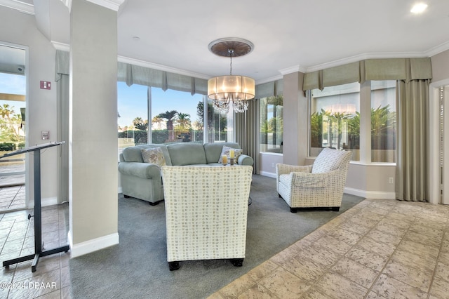 living room with dark carpet, ornamental molding, and an inviting chandelier