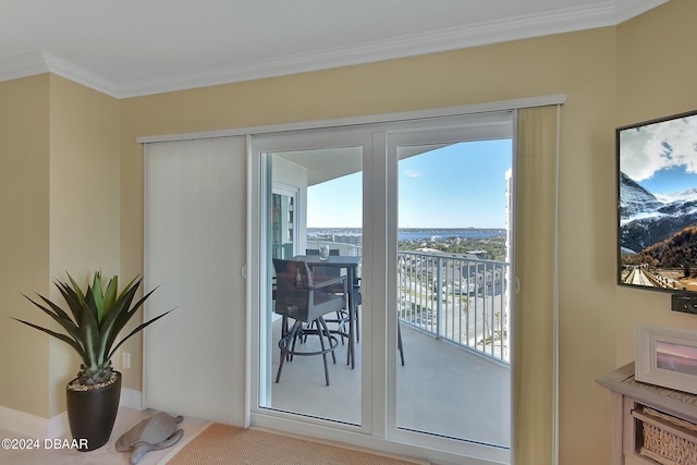 doorway to outside featuring crown molding