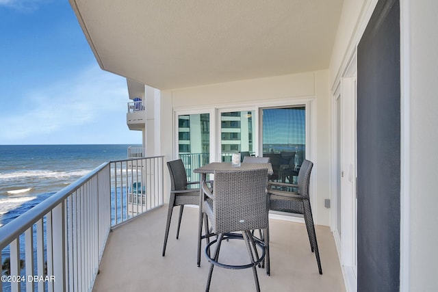 balcony featuring a water view