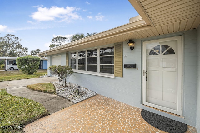 entrance to property featuring a garage