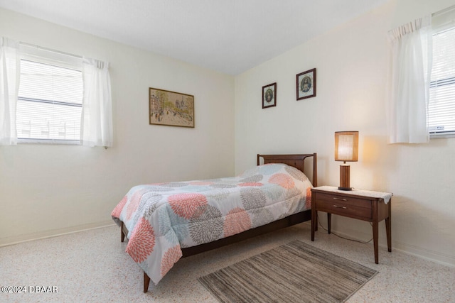 bedroom featuring multiple windows