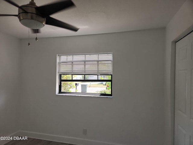 empty room featuring wood-type flooring and ceiling fan