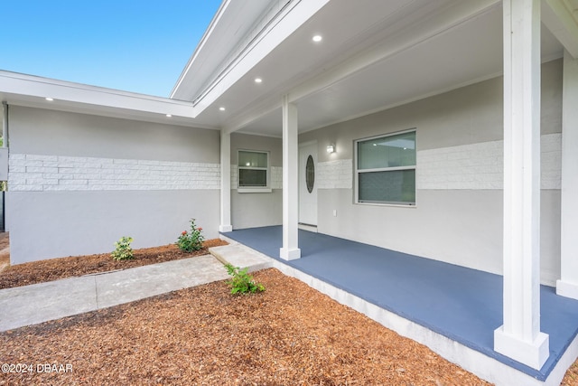 property entrance with a patio