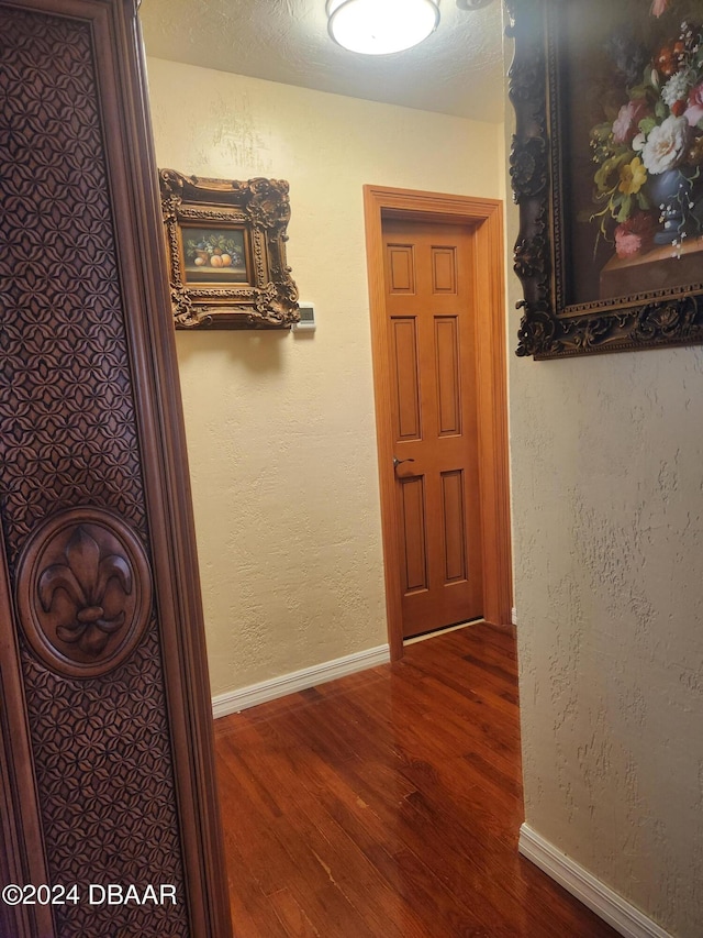 hallway featuring dark hardwood / wood-style floors