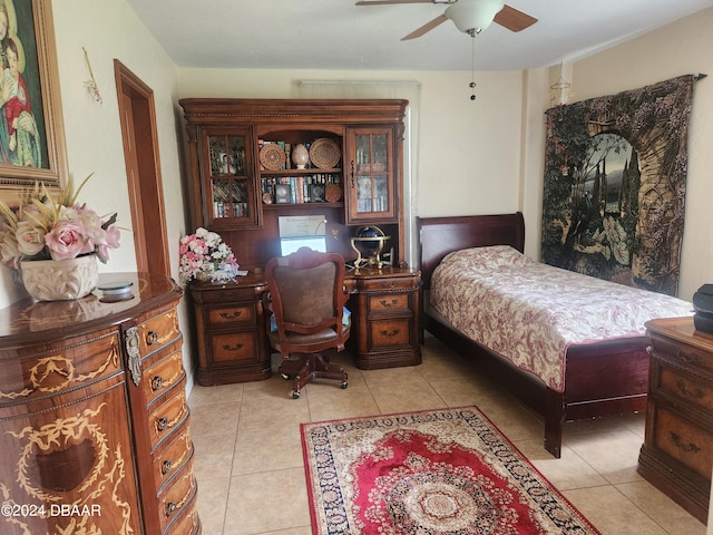 bedroom featuring ceiling fan and light tile patterned floors