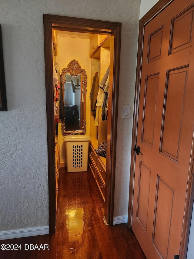 hall with dark hardwood / wood-style flooring