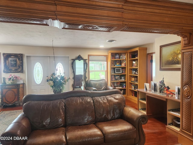 living room featuring a wealth of natural light, a textured ceiling, and dark hardwood / wood-style flooring