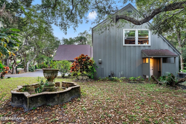 120 Beach St, Ponce Inlet, FL 32127 - view of side of property featuring board and batten siding