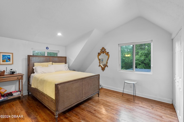 120 Beach St, Ponce Inlet, FL 32127 - bedroom featuring vaulted ceiling, multiple windows, and wood finished floors
