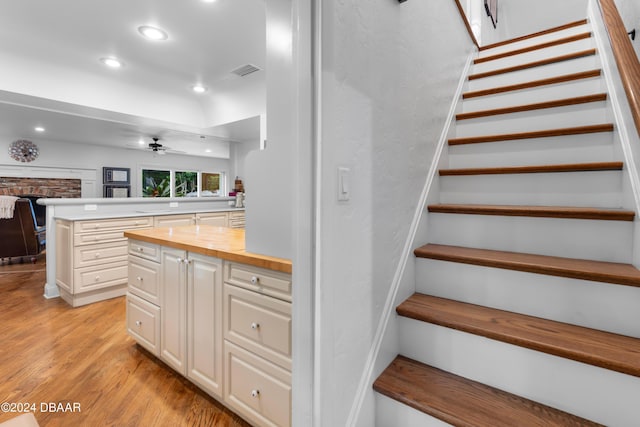 120 Beach St, Ponce Inlet, FL 32127 - staircase with recessed lighting, wood finished floors, and ceiling fan