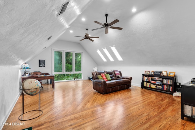 120 Beach St, Ponce Inlet, FL 32127 - living area with wood finished floors, lofted ceiling, a ceiling fan, and a textured ceiling