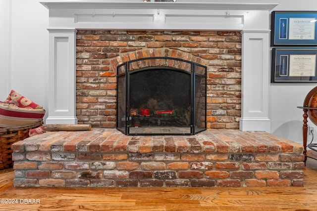 120 Beach St, Ponce Inlet, FL 32127 - detailed view of a fireplace and wood finished floors