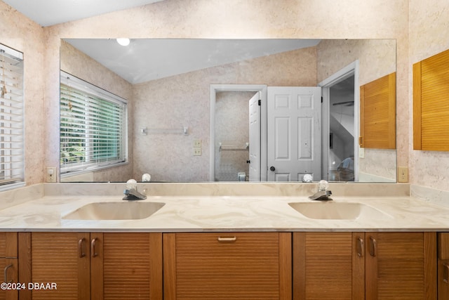 120 Beach St, Ponce Inlet, FL 32127 - bathroom featuring double vanity and vaulted ceiling