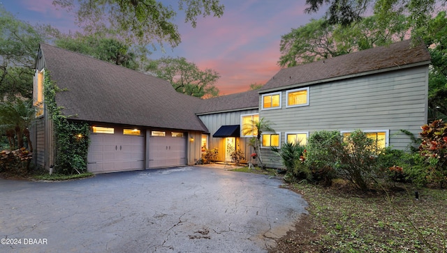120 Beach St, Ponce Inlet, FL 32127 - tri-level home featuring driveway, a garage, and board and batten siding