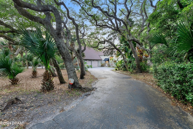 120 Beach St, Ponce Inlet, FL 32127 - obstructed view of property featuring asphalt driveway