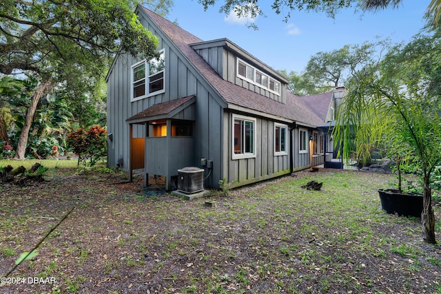 120 Beach St, Ponce Inlet, FL 32127 - rear view of property featuring roof with shingles and board and batten siding