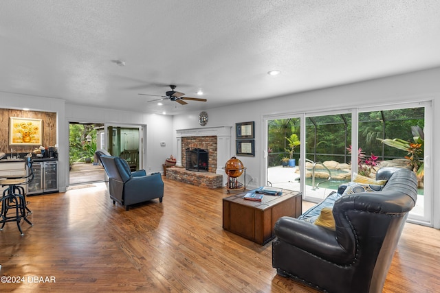 120 Beach St, Ponce Inlet, FL 32127 - living area with a textured ceiling, ceiling fan, wood finished floors, wine cooler, and recessed lighting