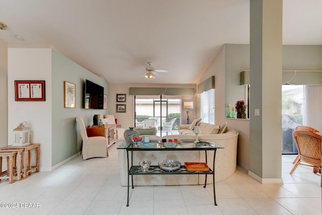 living room featuring ceiling fan and light tile patterned floors