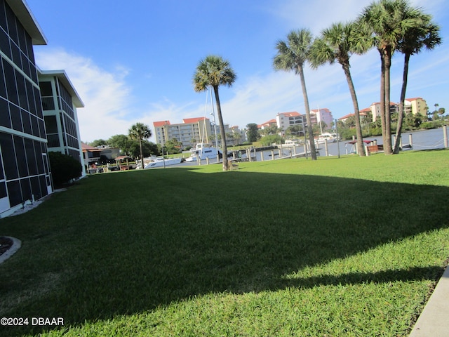 view of property's community with a yard