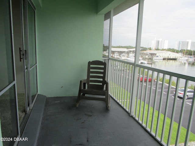 balcony featuring a water view