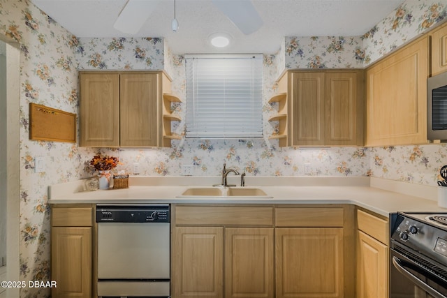 kitchen with a sink, wallpapered walls, open shelves, and dishwasher