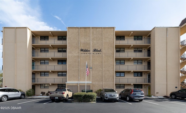 view of property featuring uncovered parking