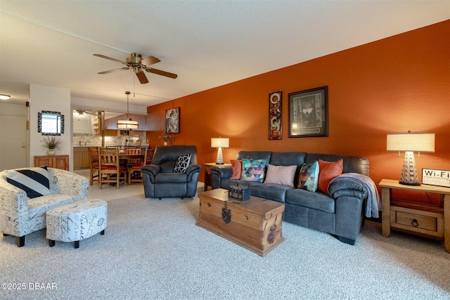 living room with light carpet and ceiling fan