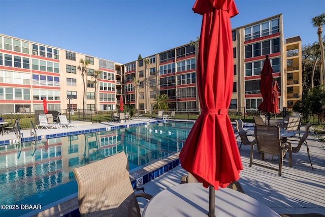 view of pool with fence and a patio