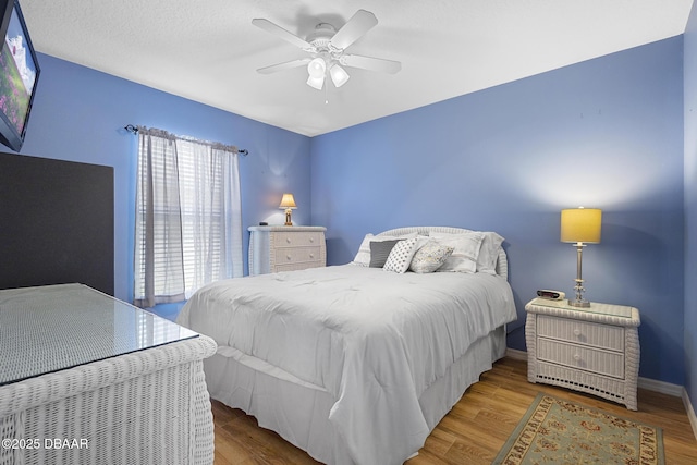 133 Brasswood Ct, Daytona Beach, FL 32117 - bedroom featuring baseboards, wood finished floors, and a ceiling fan