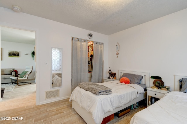 bedroom featuring a textured ceiling