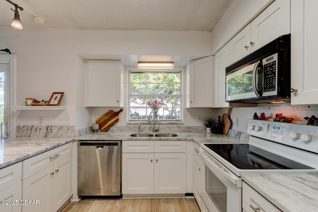 kitchen with sink, white cabinetry, dishwasher, light stone counters, and white electric stove