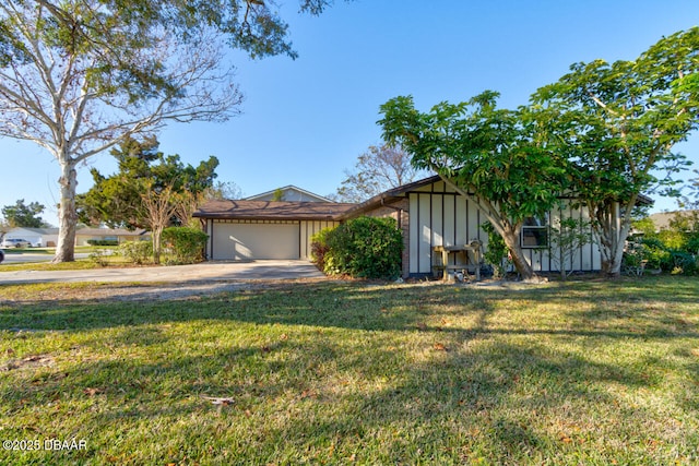 view of front of house featuring a front yard and a garage