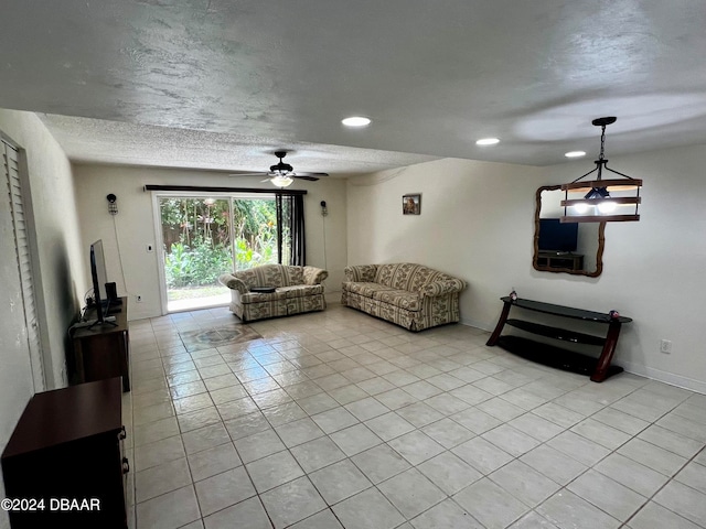 living room featuring light tile patterned flooring and ceiling fan