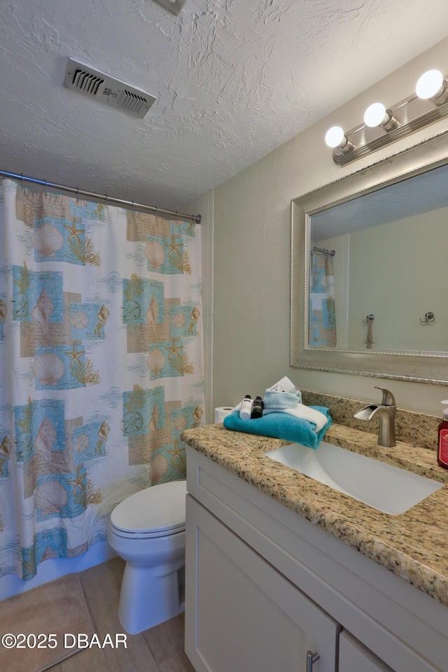 2625 S Atlantic Ave Unit 10Nw, Daytona Beach Shores, FL 32118 - full bathroom with vanity, a textured ceiling, and curtained shower