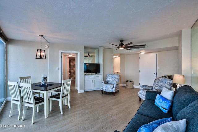 2625 S Atlantic Ave Unit 10Nw, Daytona Beach Shores, FL 32118 - living room featuring ceiling fan and light wood finished floors