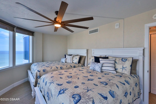 2625 S Atlantic Ave Unit 10Nw, Daytona Beach Shores, FL 32118 - bedroom featuring wood finished floors and ceiling fan