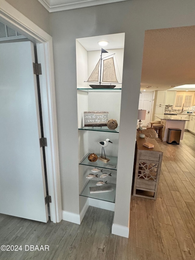 interior space featuring hardwood / wood-style flooring and tasteful backsplash