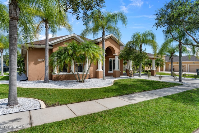 view of front of property with a front lawn