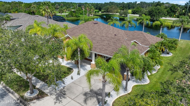 birds eye view of property with a water view