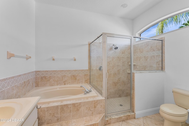 full bathroom with separate shower and tub, tile patterned flooring, vanity, and toilet